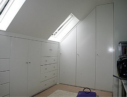 White corner wardrobe in the attic