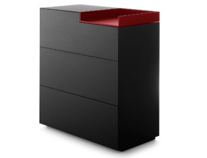 A Matt black chest of drawers with red insert