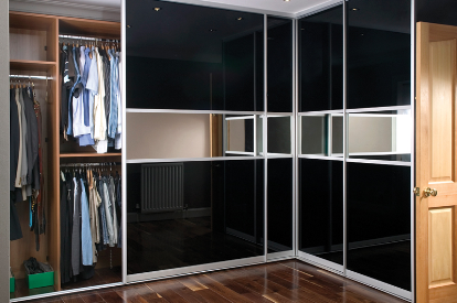Corner wardrobe with black glossy facade